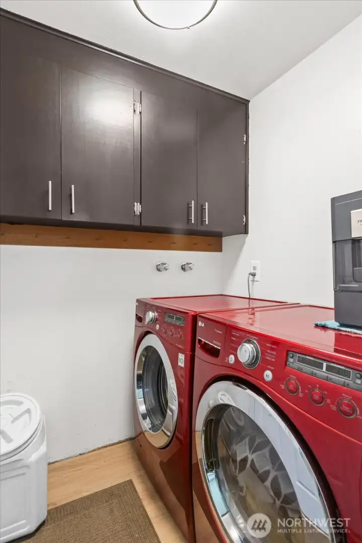Laundry room off the dining room area with convenient backyard access.