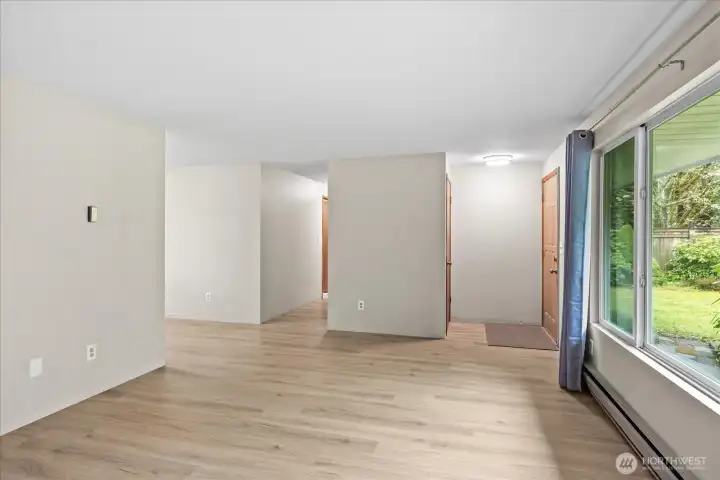 Hallway off of dining room and living room leads to the bedrooms and bathrooms in the home.