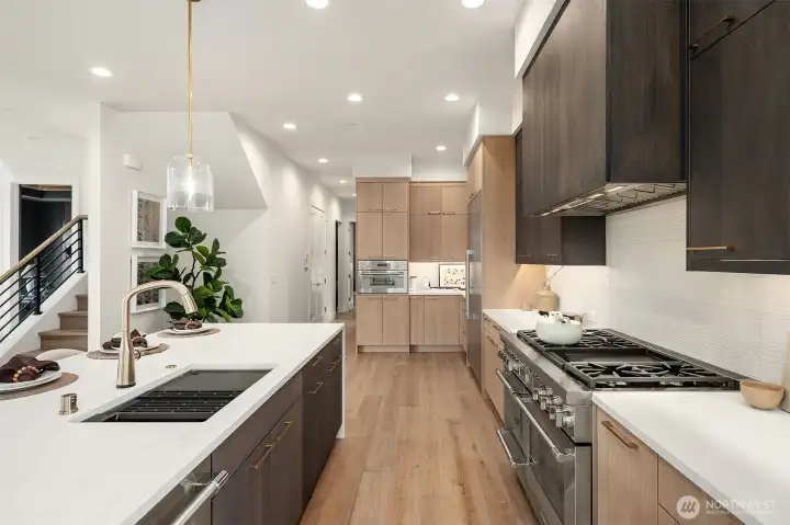 An abundance of gorgeous cabinets and counter space. Mounted Thermador speed oven, for a total of three ovens- An entertainer's dream! An abundance of gorgeous cabinets and counter space. Mounted Thermador speed oven, for a total of three ovens- An entertainer's dream!