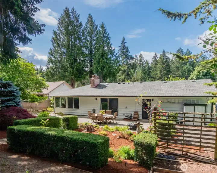 Rear exterior of home and back yard