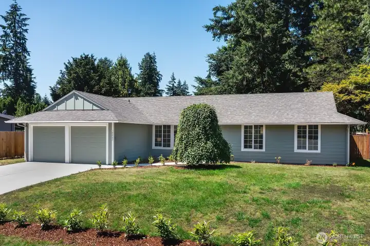 Huge front yard and  spacious two car garage.