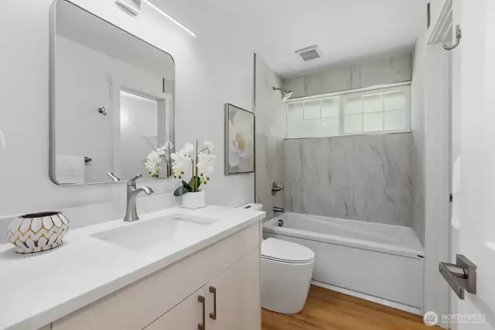 Fully renovated bathroom with new window.