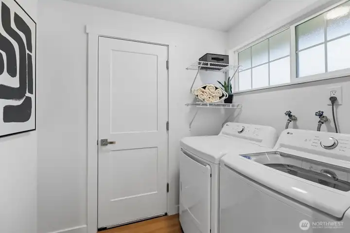 Full size washer and dryer in the utility room.
