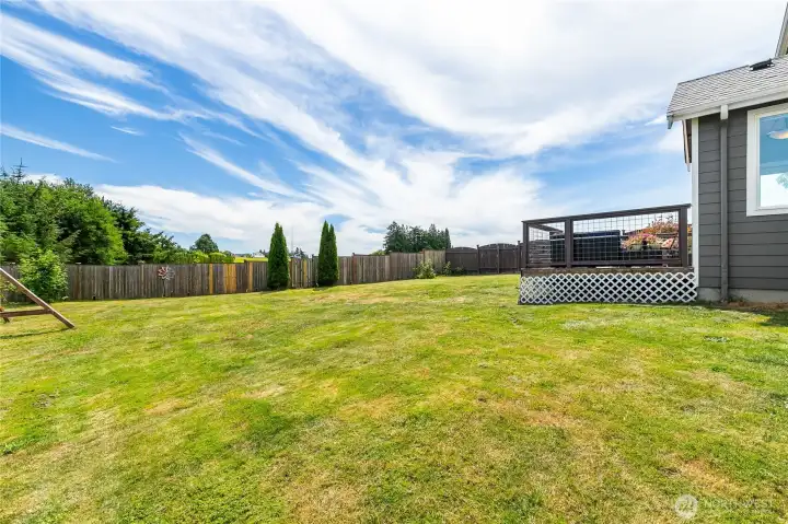 Huge backyard with an empty field behind. Huge backyard with an empty field behind.