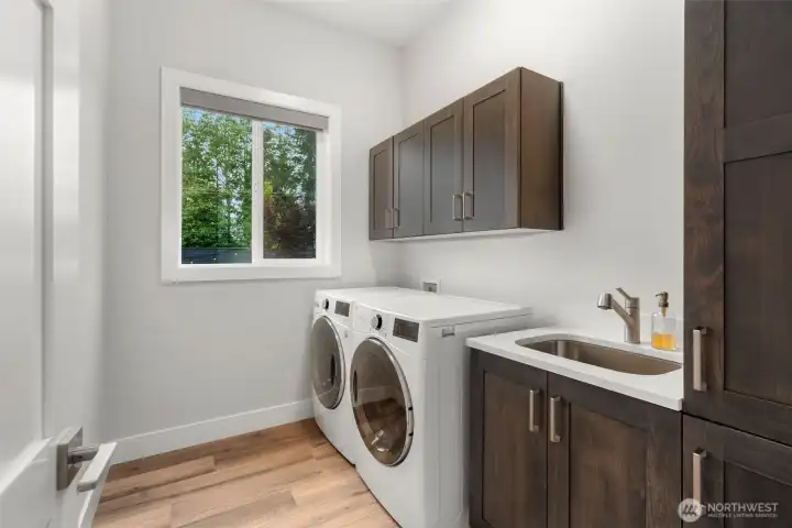 Spacious laundry room with ample storage.