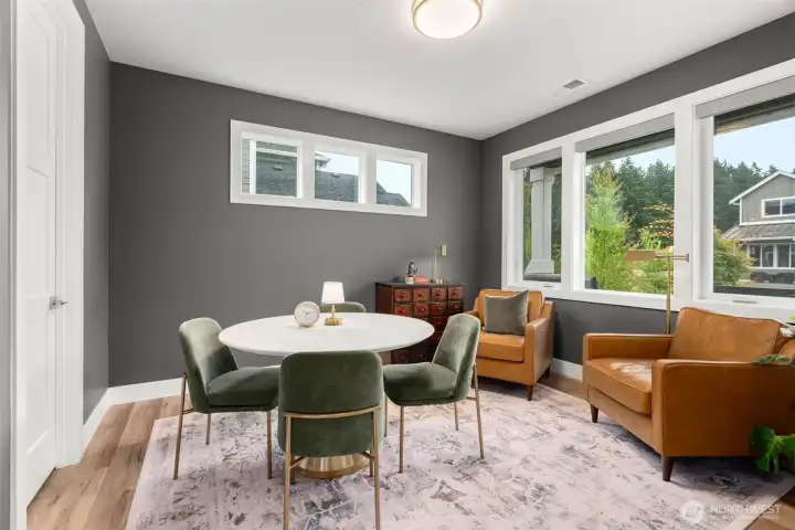 Main-level office/formal dining/den option with abundant natural light.