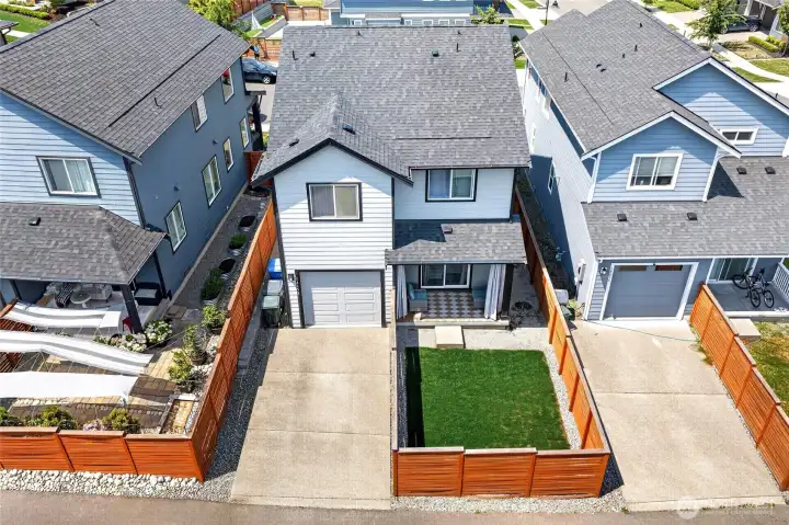 Outside, a covered back patio and fully fenced backyard create an inviting extension of the home for relaxing, entertaining or play. Outside, a covered back patio and fully fenced backyard create an inviting extension of the home for relaxing, entertaining or play.