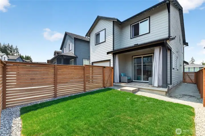 Outside, a covered back patio and fully fenced backyard create an inviting extension of the home for relaxing, entertaining or play. Outside, a covered back patio and fully fenced backyard create an inviting extension of the home for relaxing, entertaining or play.