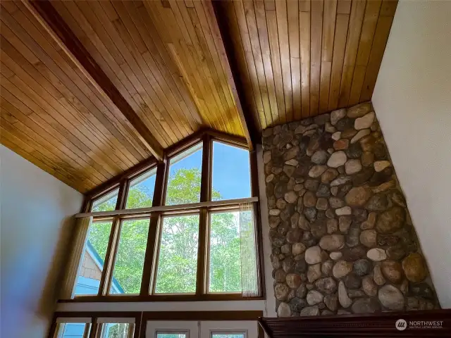 Wonderful wood vaulted ceiling and stone fireplace add appeal and warmth.