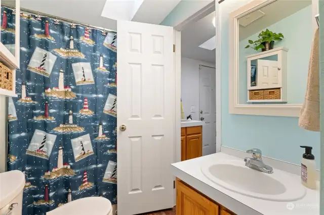 This is the main full bath, and the primary bedroom has its own private bath, of course! Another skylight keeps this are bright and cheery, even on the darkest NW winter day!