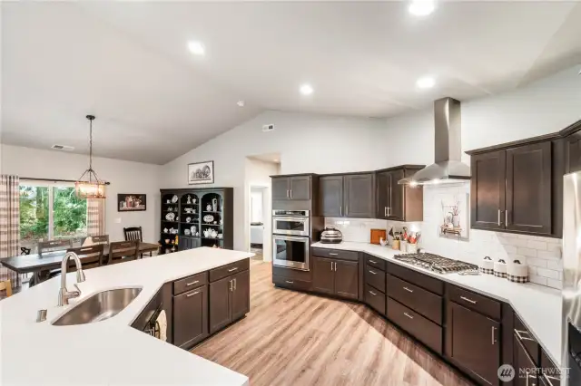 Propane Stove, built in oven & microwave, trash/recycle in a cupboard, too. All appliances are included!