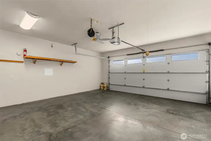 Spacious and deep two-car garage with room for storage.