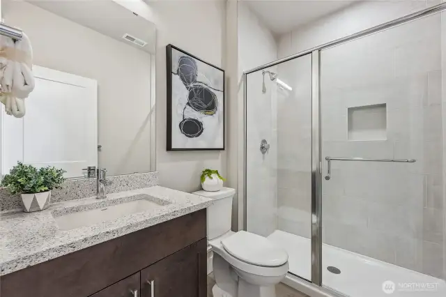 Main floor Bathroom with Shower. Photos are for representational purposes only.  Colors and options may vary.