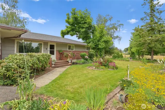 Lots of established landscaping including fruit trees for your enjoyment.