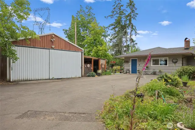 Plenty of storage on this property with several outbuildings. This is one of the bigger shop spaces with a lien-to.