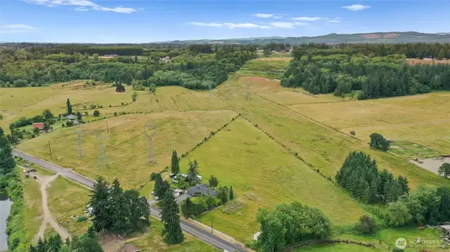 Aerial view highlights the lot layout, enclosed with fencing. Ample space for farming, or your farm animals.