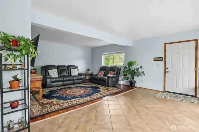 Secondary living space. Door leads to front of home and driveway.