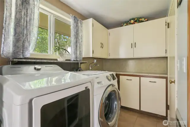 Utility space is off of dining room and secondary living area. W/D stay with home.