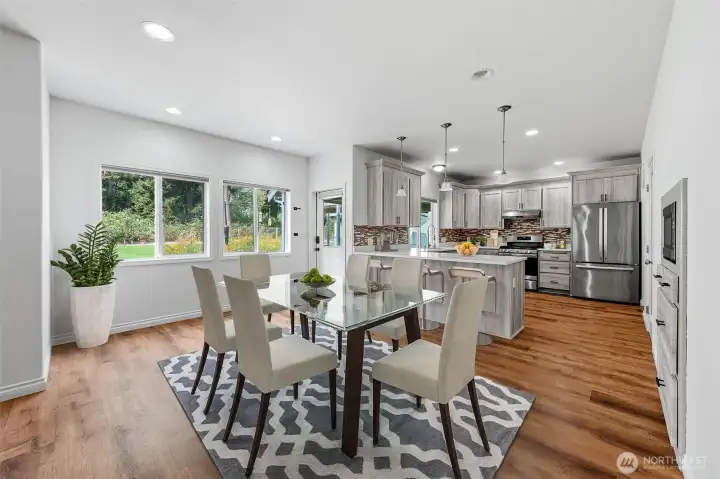 Virtually staged dining in between kitchen and family room