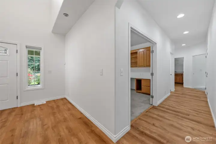 Front door area looking down hallway from family room