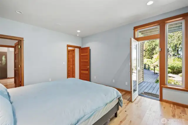 Main floor primary with walk out deck access to the beautiful view