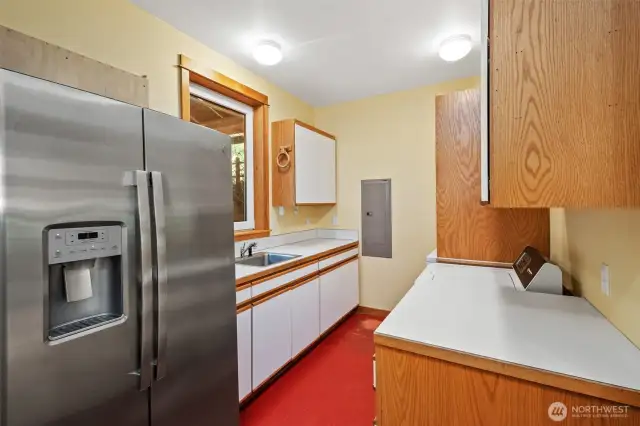 Laundry room on main floor with door to portico