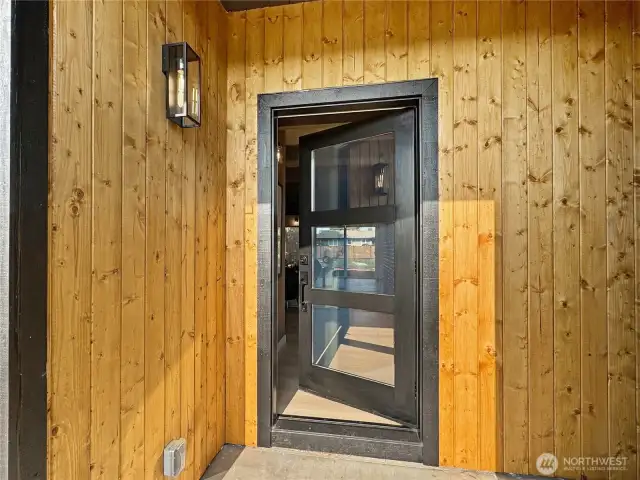 Gorgeous wood clad entry illudes to spectacular wooden accents that await inside.