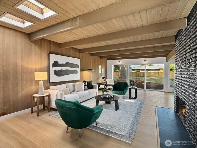 Dual skylights and massive windows flood this home with natural light