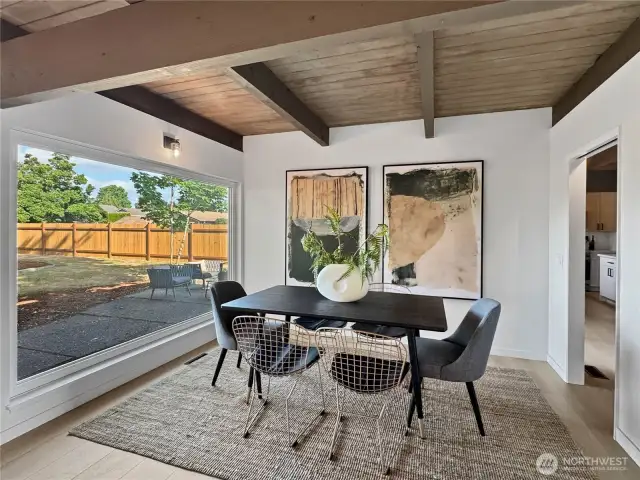 Dining room off the living room and connected to the kitchen via pocket door