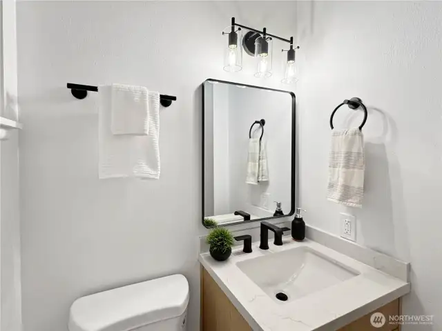 Powder half bathroom off the kitchen and laundry room