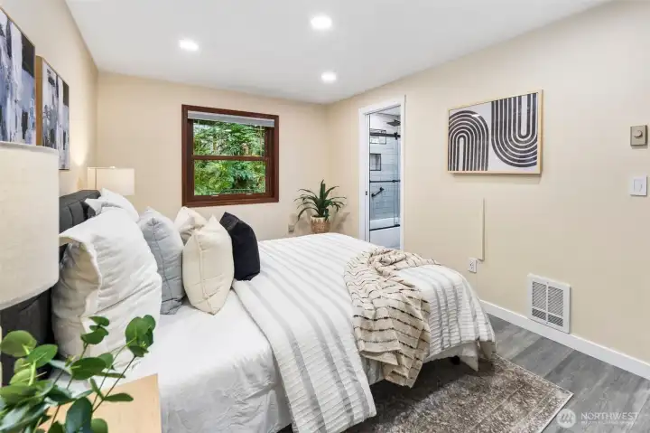 A thoughtful layout connects this main floor bedroom directly to the remodeled bath, creating flexibility for use as a guest suite or private retreat. Also convenient for older family members who need a bedroom on the main floor.