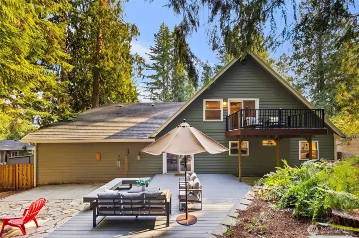 The home features a durable rubber roof, built over the existing composite roof approximately 10–12 years ago, designed as a 50-year roof. It includes metal flashing along the valleys for added protection. The roof was inspected by Squatch Roofing of Woodinville. Gutters were replaced in 2023 with extra-wide, leaf-guard gutters by High Point Roofing, who also cleaned and serviced them on 8/21/2025.