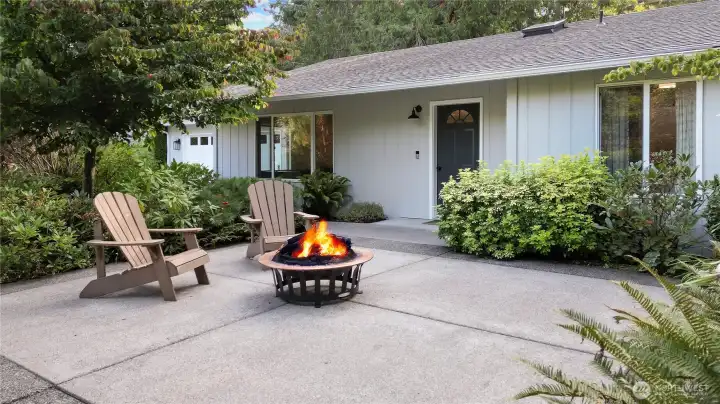 Amazing landscaping front and back at this home, and I love this front patio/firepit area.