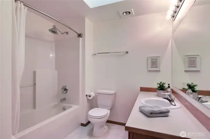 Kids/Guest full bath. Love the skylight and heat lamp!