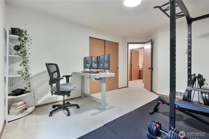 Bedroom #3, currently used as an office and workout room. Weight set can stay!