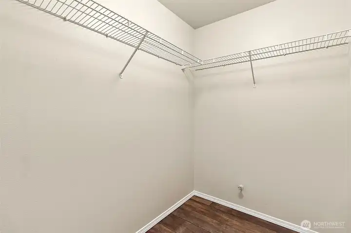 A generous walk-in closet adds comfort and convenience, offering abundant space to stay organized in style.