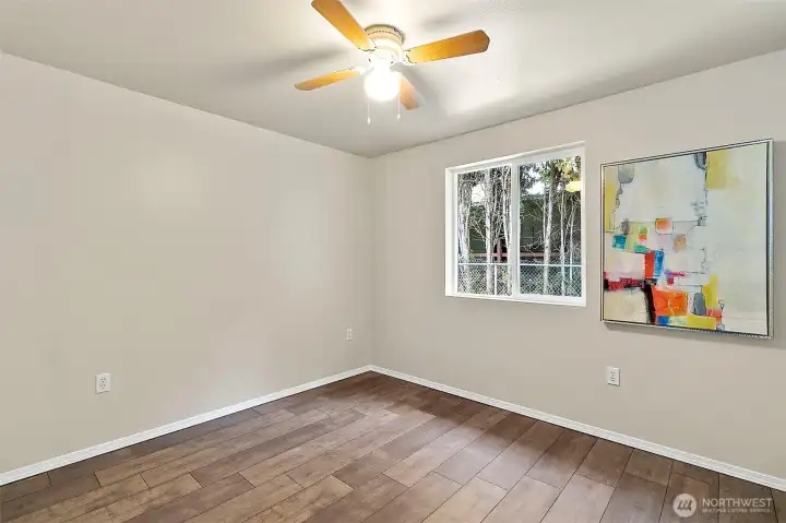One of the three bedrooms all with new LVP flooring and they all have ceiling fans.