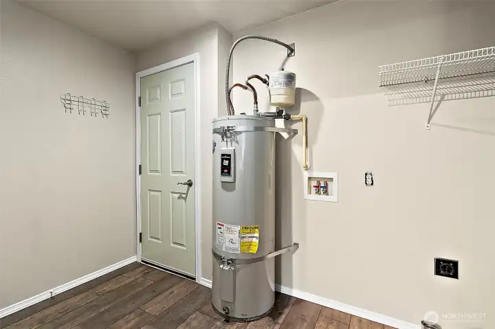 A generous utility/mud room adds extra storage and functionality—ideal for laundry, gear, and keeping things in order.