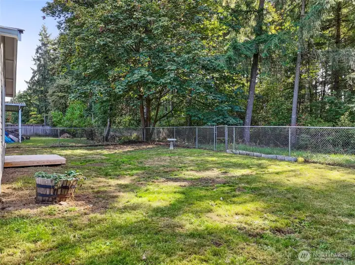 You’ll love spending time outdoors on the spacious, level lot—fully fenced for pets and privacy, with plenty of room to garden, entertain, or just unwind.