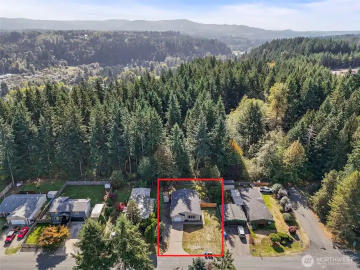 The aerial view captures this 2006-built home’s charm—complete with a new roof, fresh interior paint, new LVP flooring, and plenty of RV parking. Updated, inviting, and ready to enjoy!