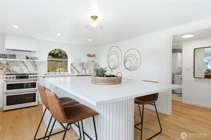 This stylishly updated kitchen is a chef's dream. Huge island is perfect for a gathering with friends or just a quiet breakfast in the morning.