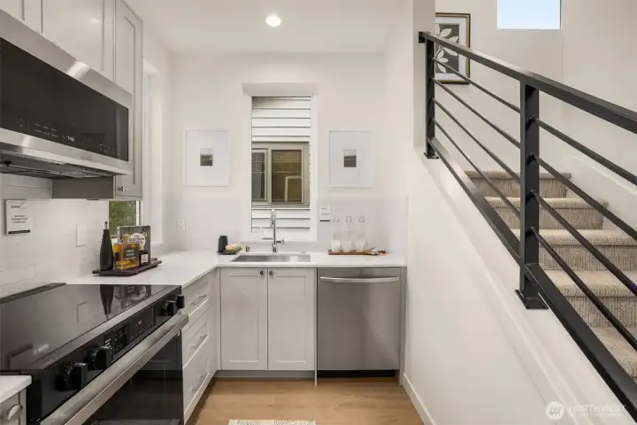 Modern cabinetry and ample counter space make this kitchen as functional as it is beautiful.