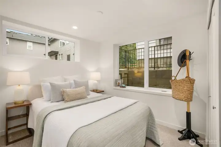 Well-appointed bedroom featuring garden views and a cozy, private atmosphere.
