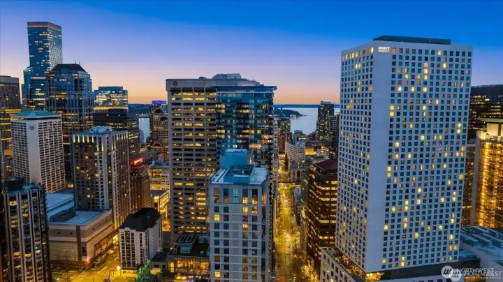hyatt regency featuring Daniels broiler is to the right, Olive 8 hyatt is the center building feature Tidal restaurant with blue glass and to the left is the Grand Hyatt- all three of these HYATTS are owned by a local family and keep the highest standard of quality and luxury hotels.