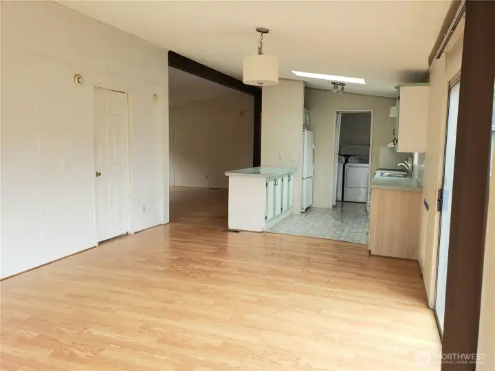 Another Picture of the Spacious Kitchen and Second Living Room Showing Skylight, Cathedral Ceiling, Skylight Laminate Flooring.