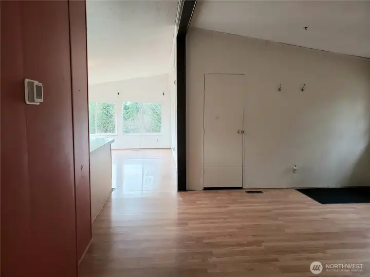 Another View of the Living Room Looking into the Kitchen and Second Living Room.