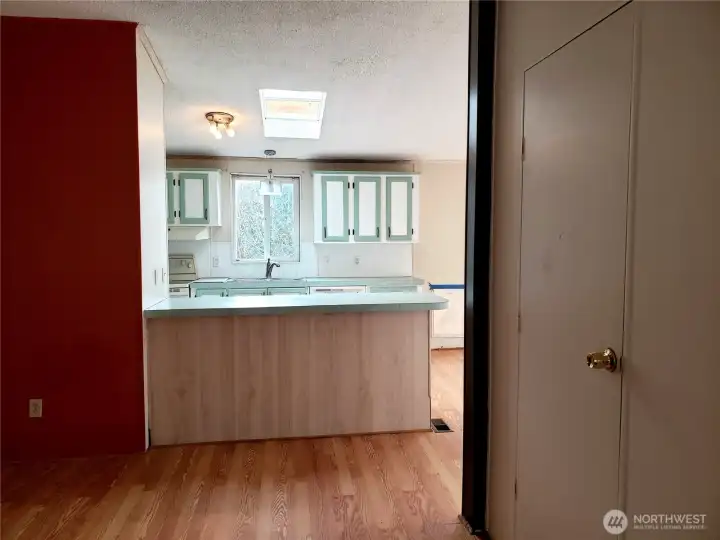 Another View of the Living Room Looking into the Kitchen from the Front Entry Door.