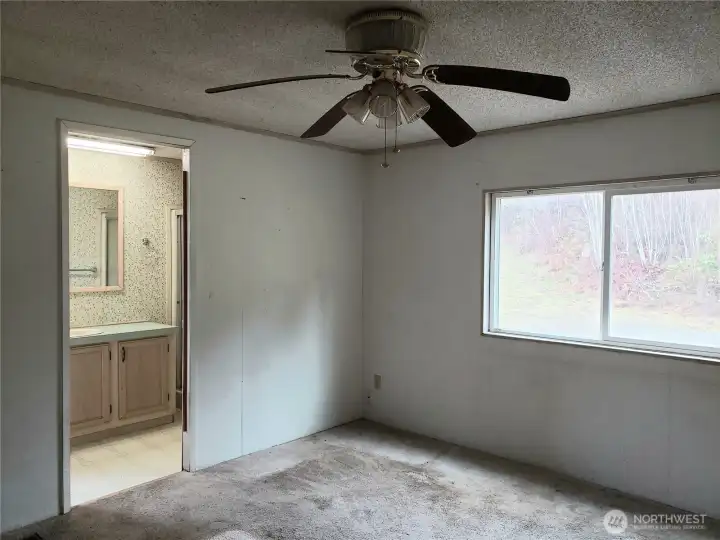 Another View of the Spacious Primary Master Bedroom Showing Entry into Bathroom.