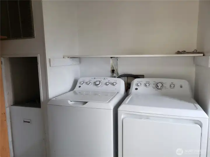 Separate Utility Room with Shelf and Washer Dryer that Stays.