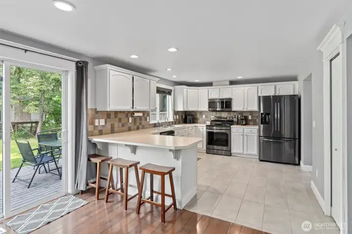 Kitchen with access to sunny deck